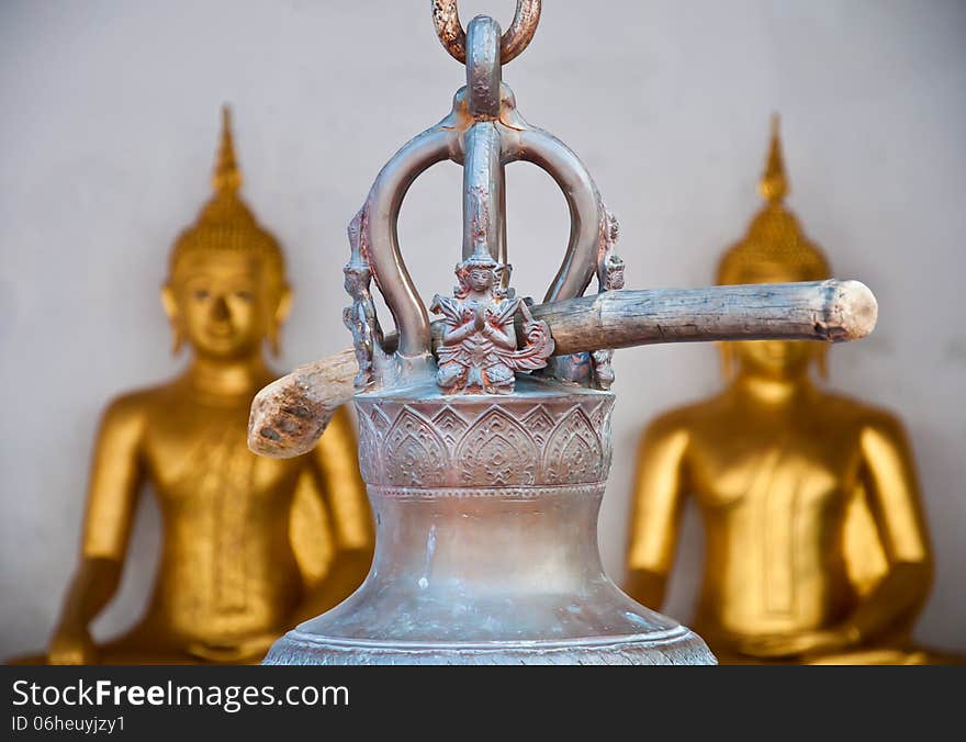 The wooden stick hange on the thai style bell at Yai Suwannaram temple in Petchaburi, Thailand. The wooden stick hange on the thai style bell at Yai Suwannaram temple in Petchaburi, Thailand