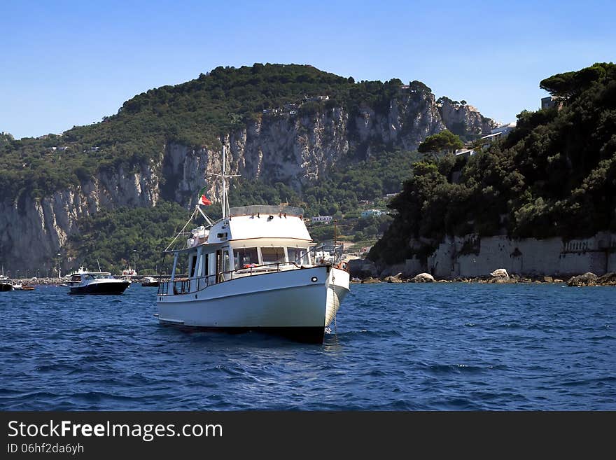 Yacht anchored in the north coast of Capri island in Italy. Yacht anchored in the north coast of Capri island in Italy