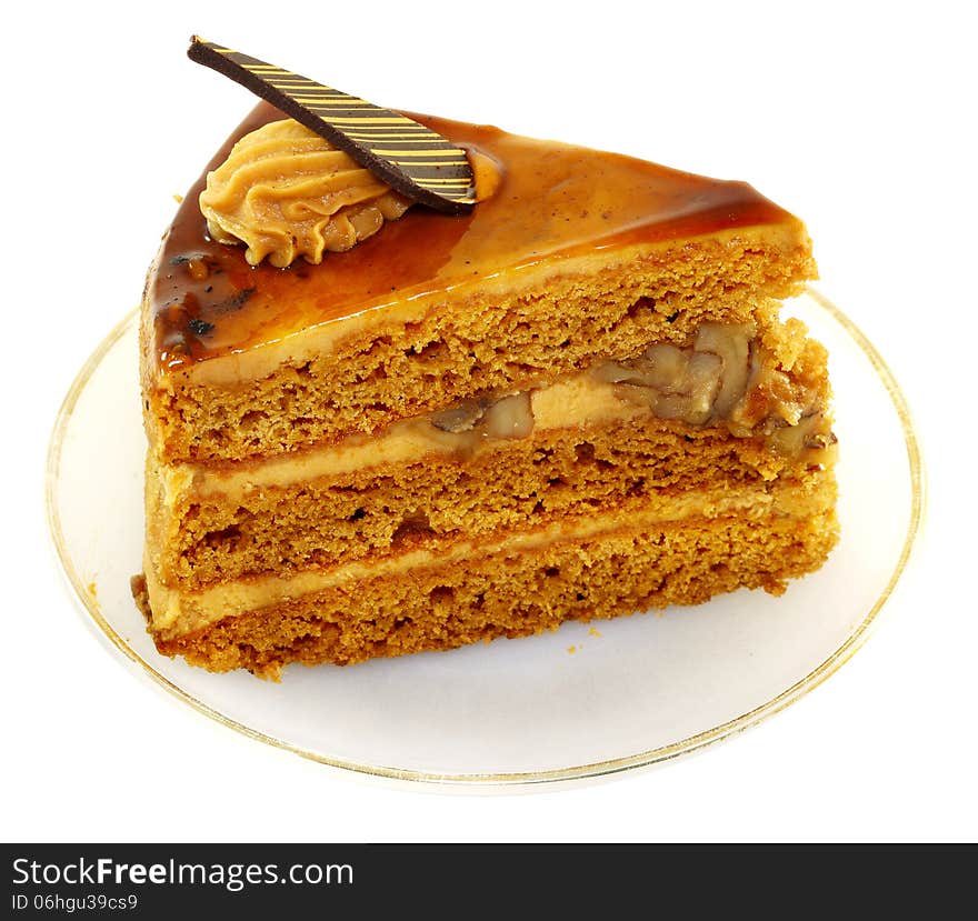 Delicious honey piece of cake on a white background. Delicious honey piece of cake on a white background