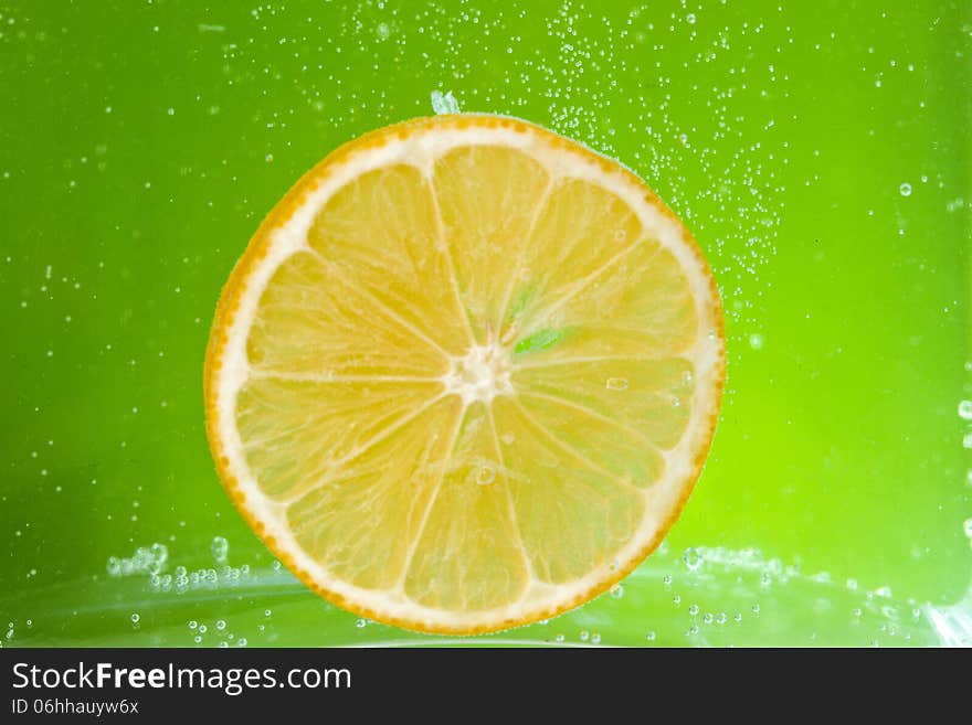 Glass citrus squeezer with lemons and juice