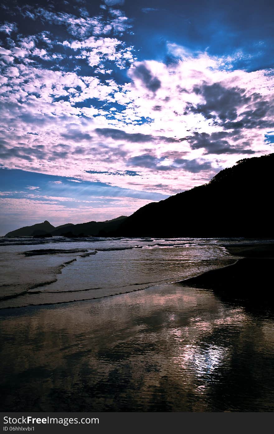 Dramatic Tropical Sunset at Lopes Mendes Beach, Ilha Grande Island, Rio de Janeiro State, Brazil. Dramatic Tropical Sunset at Lopes Mendes Beach, Ilha Grande Island, Rio de Janeiro State, Brazil.