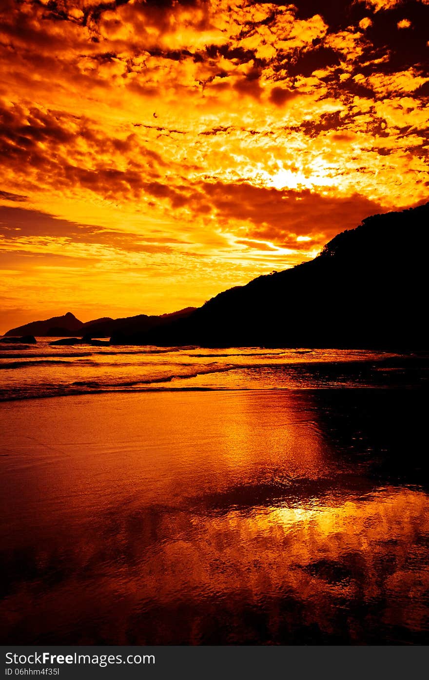 Dramatic Tropical Sunset at Lopes Mendes Beach, Ilha Grande Island, Rio de Janeiro State, Brazil. Dramatic Tropical Sunset at Lopes Mendes Beach, Ilha Grande Island, Rio de Janeiro State, Brazil.