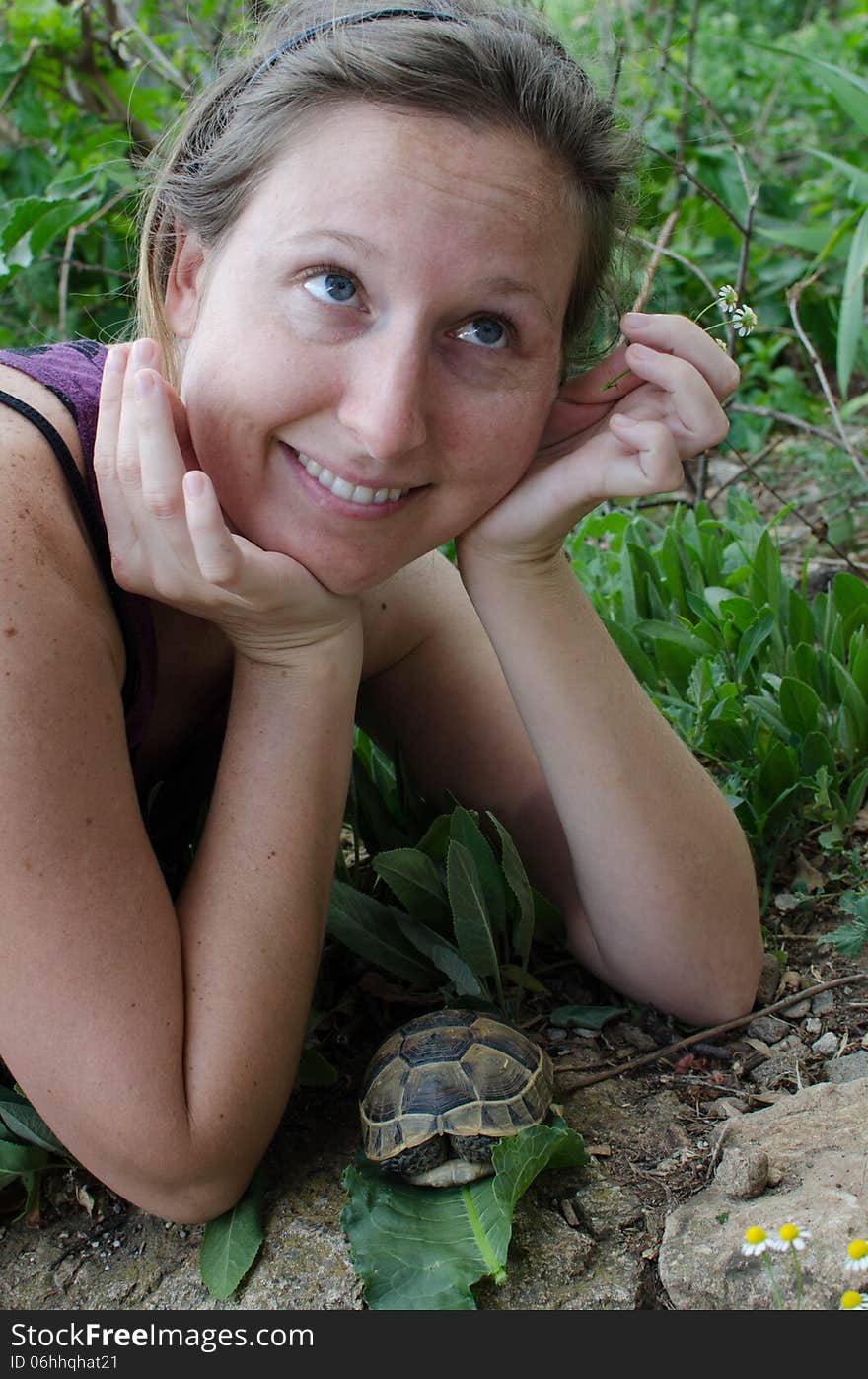 Girl with a baby tortoise