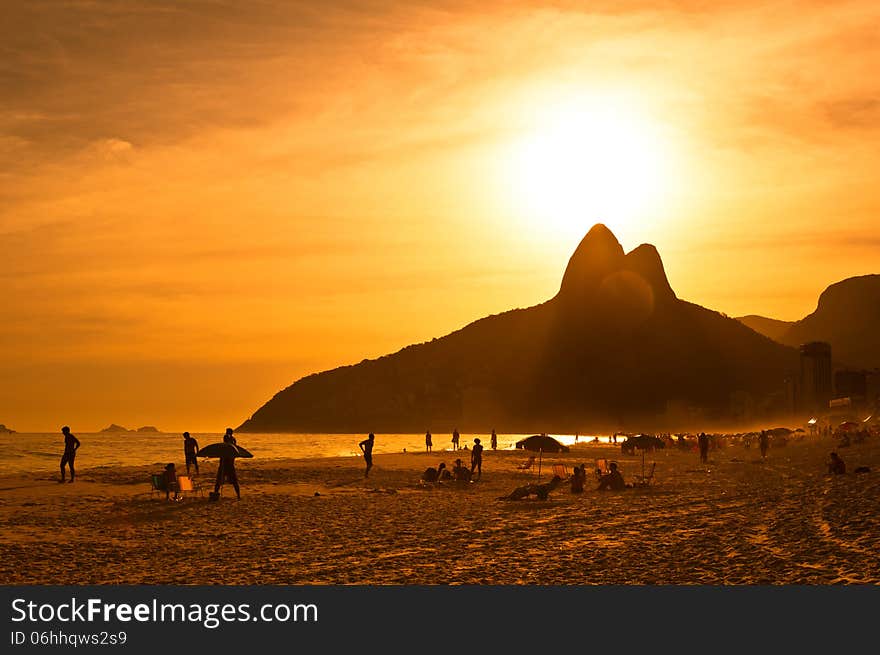 Warm Sunset on the Beach with Mountains in Horizon