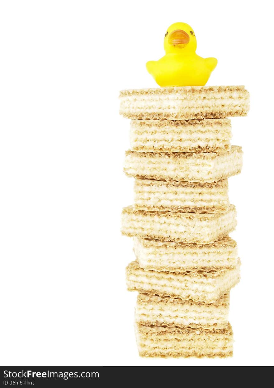 Small duck on high tower stack wafer on white background