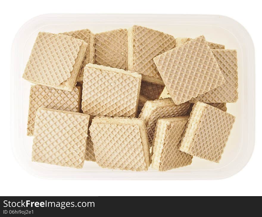 Pieces of wafer pile in plastic storage on white background. Pieces of wafer pile in plastic storage on white background