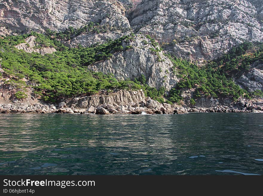 Coastal cliffs, coastline, rocky shore, the view from the sea side, Crimea peninsula, Ukraine, Black Sea Coast