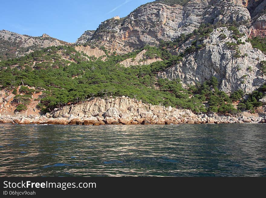 Coastal cliffs, coastline, rocky shore, the view from the sea side, Crimea peninsula, Ukraine, Black Sea Coast