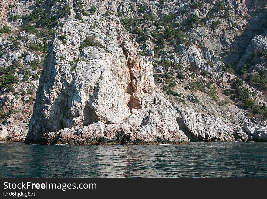 Coastal cliffs, coastline, rocky shore, the view from the sea side, Crimea peninsula, Ukraine, Black Sea Coast