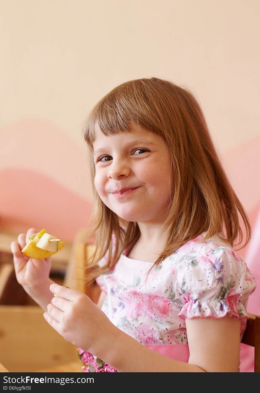 Girl eating fruit