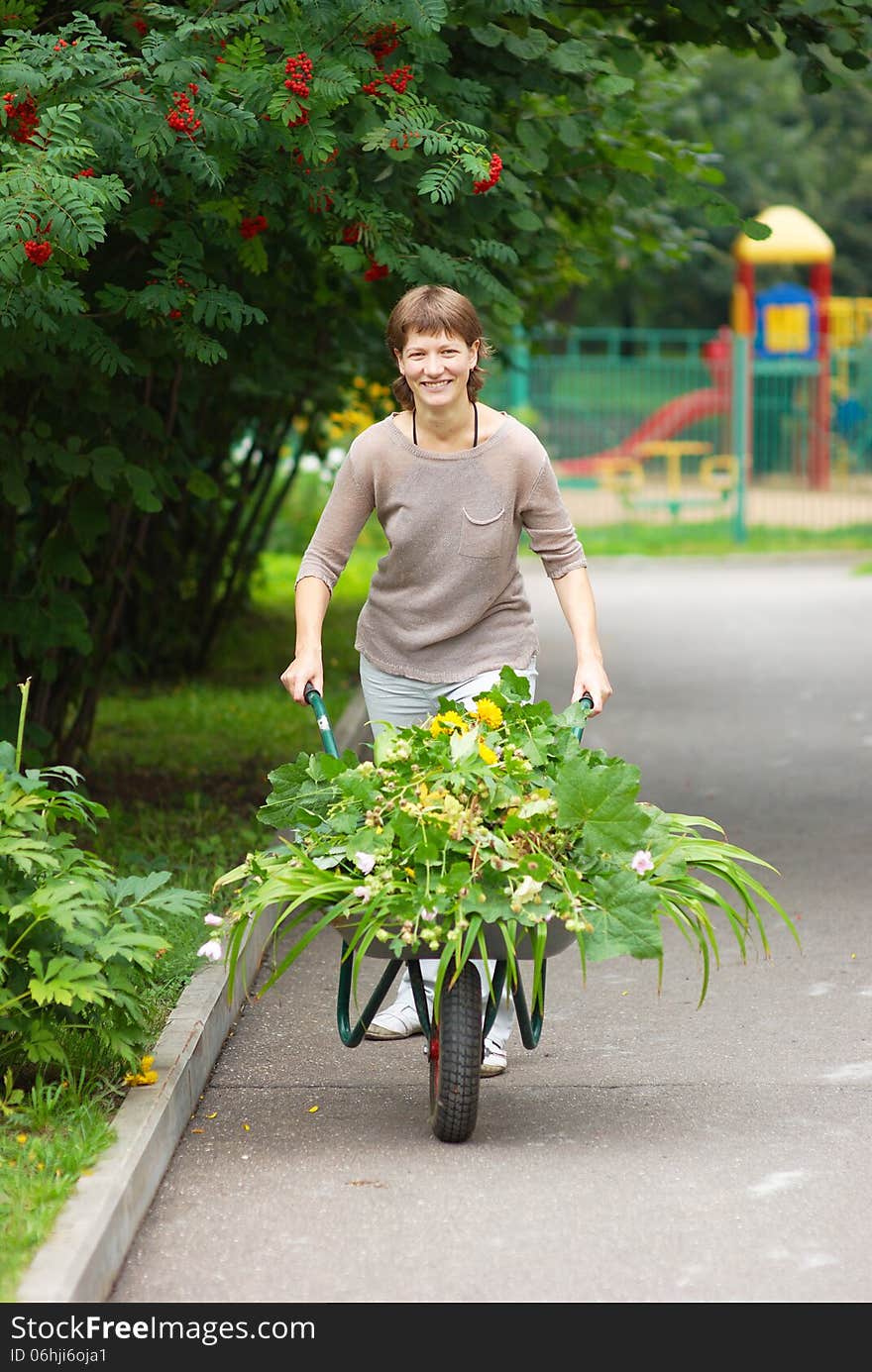 Girl with garden wheelbarrow