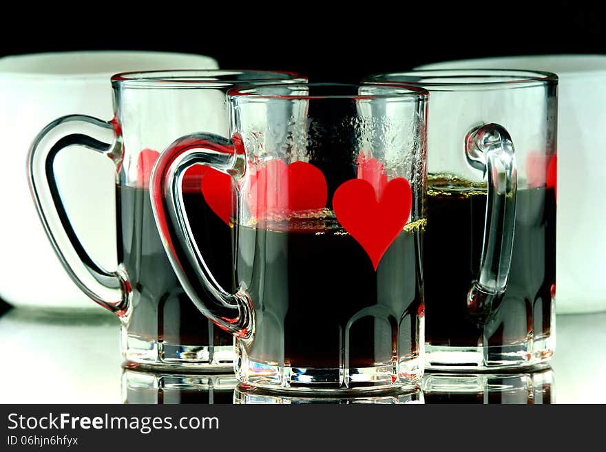 Coffee shots of whiskey in glass with hearts. Coffee shots of whiskey in glass with hearts