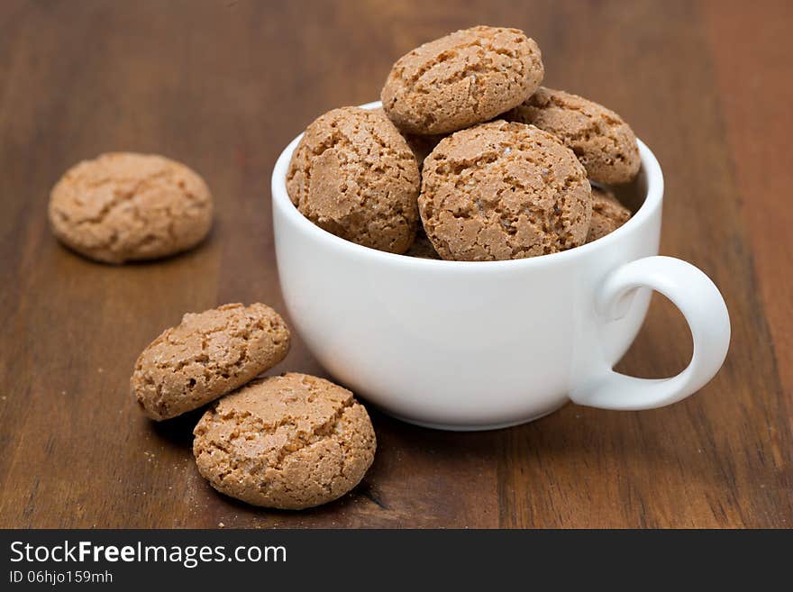 Biscotti cookies in a cup on wooden table, horizontal. Biscotti cookies in a cup on wooden table, horizontal