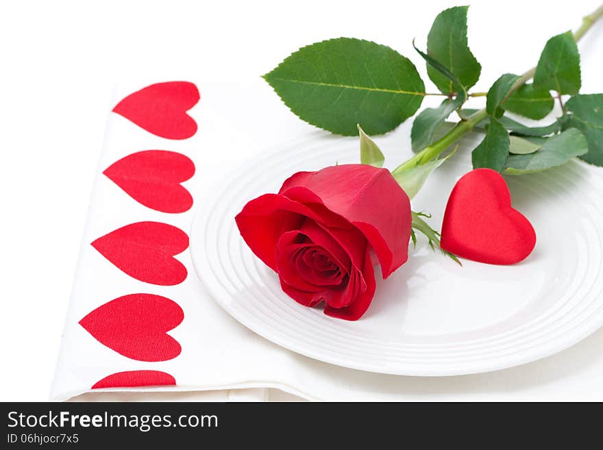 Festive table setting with rose and heart, close-up