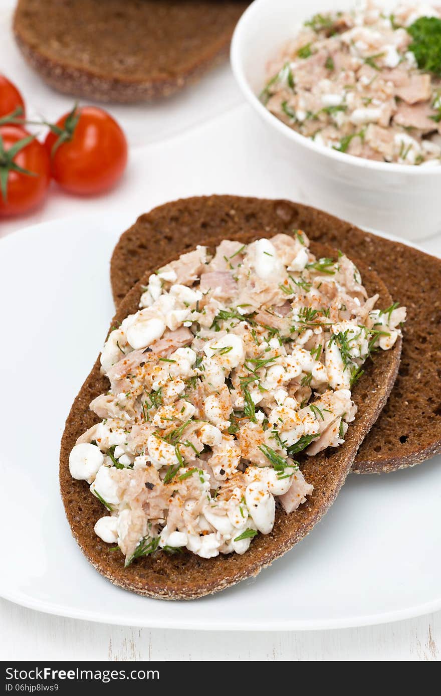 Rye bread with tuna, homemade cheese and dill, vertical, top view