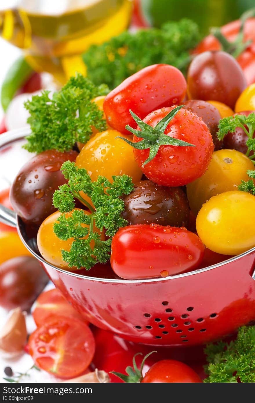 Assorted fresh cherry tomatoes, herbs and spices, close-up