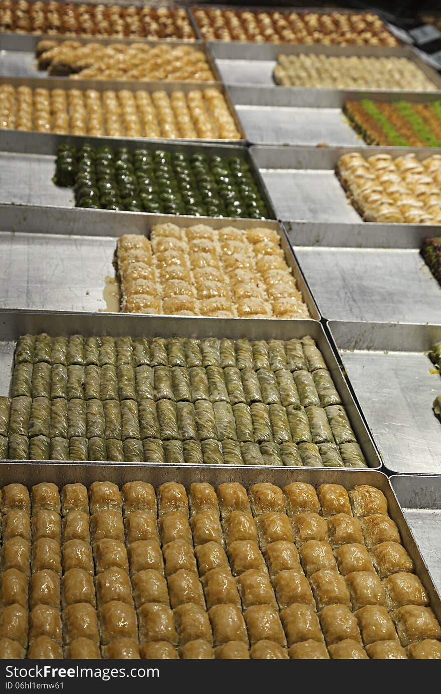 Various turkish baklava on trays in a shop. Various turkish baklava on trays in a shop