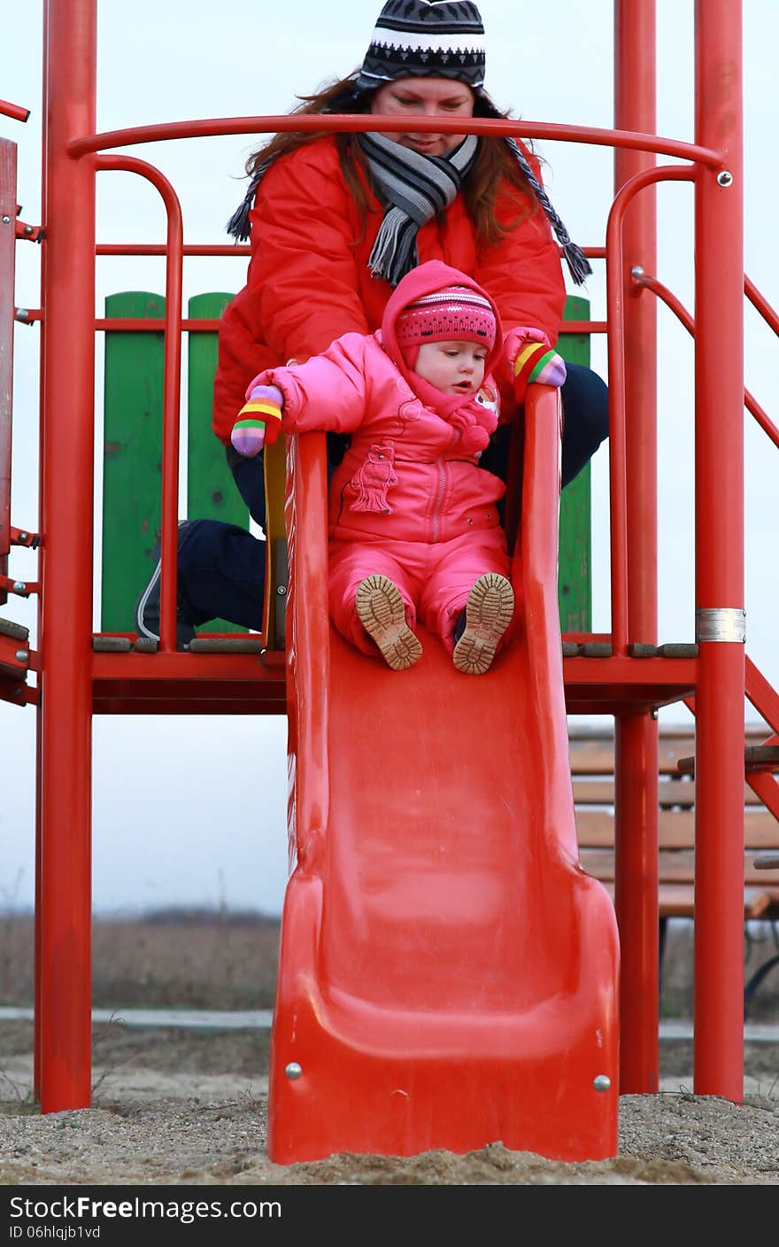 Gorgeous baby girl playing in the park with her mother. Gorgeous baby girl playing in the park with her mother