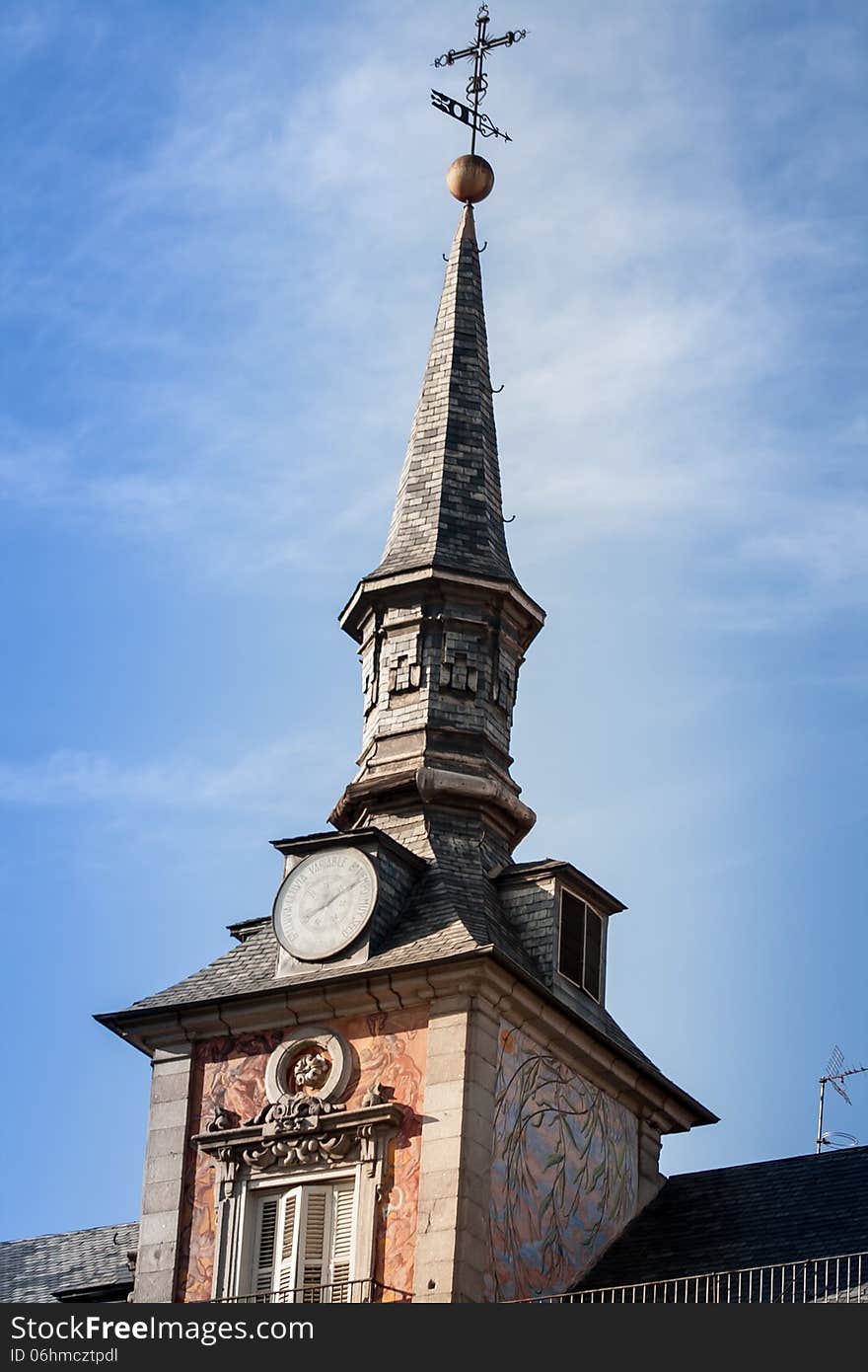 Church steeple in madrid against a blue sky