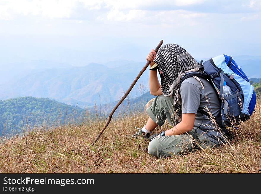 Traveler resting during a trip on the mountain.