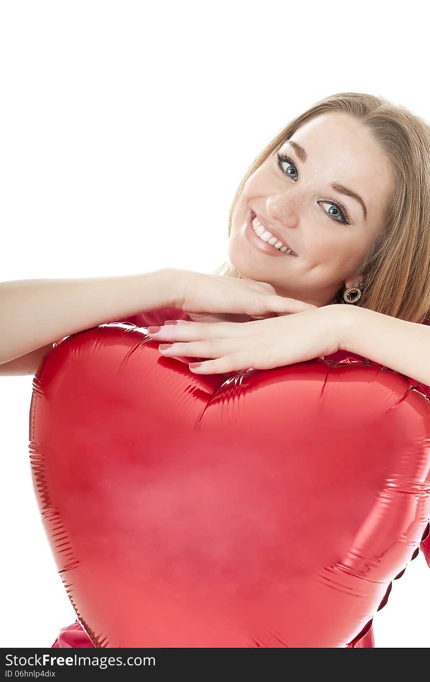 Smiling woman holding red heart balloon over white background. Valentines day concepts.