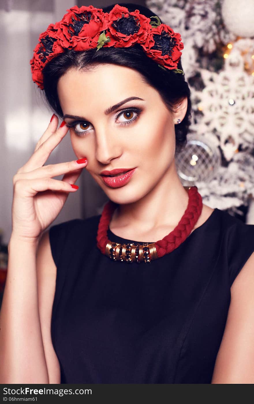 Beautiful girl with black hair with christmas tree on background. Beautiful girl with black hair with christmas tree on background