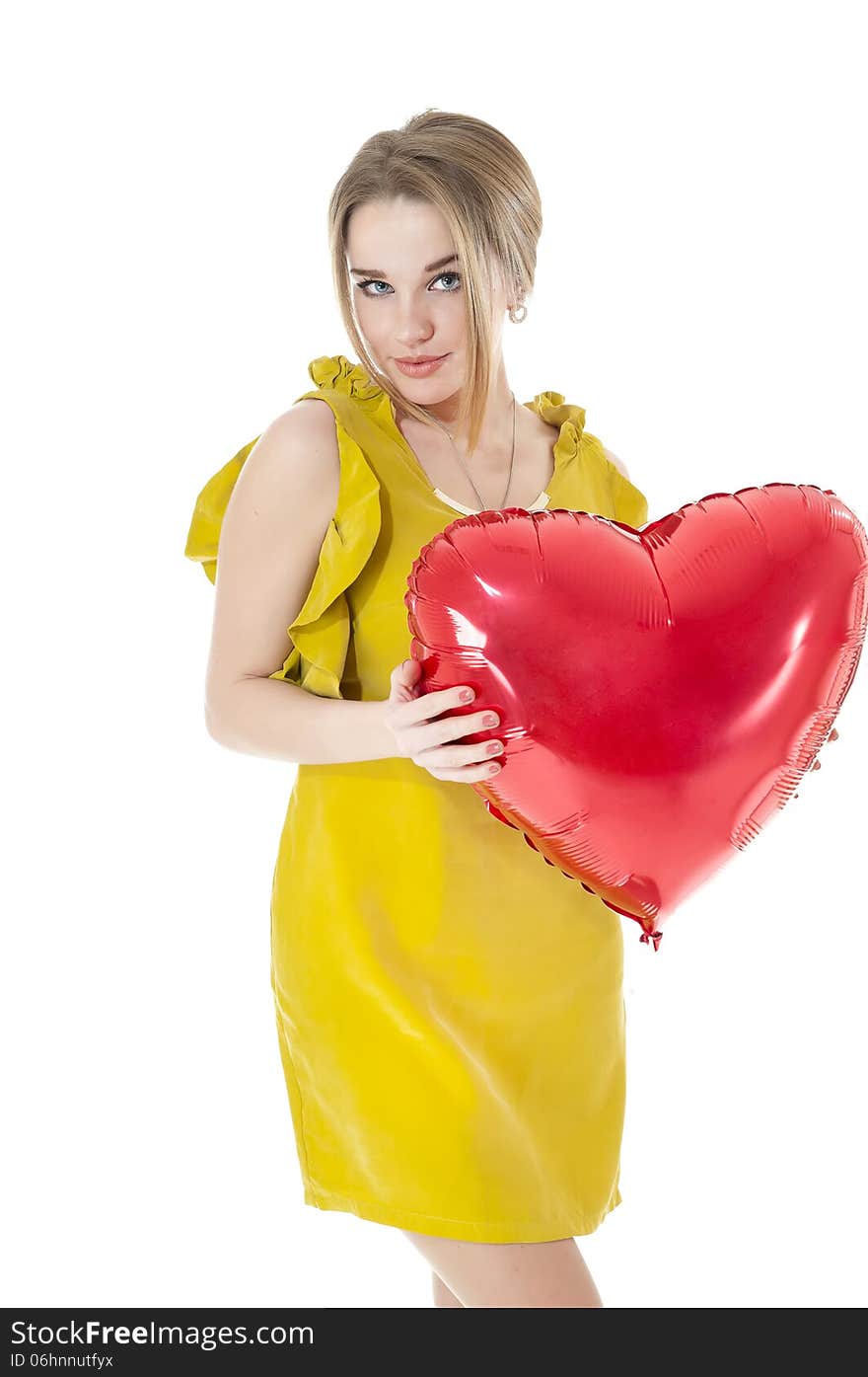 Woman holding red heart balloon