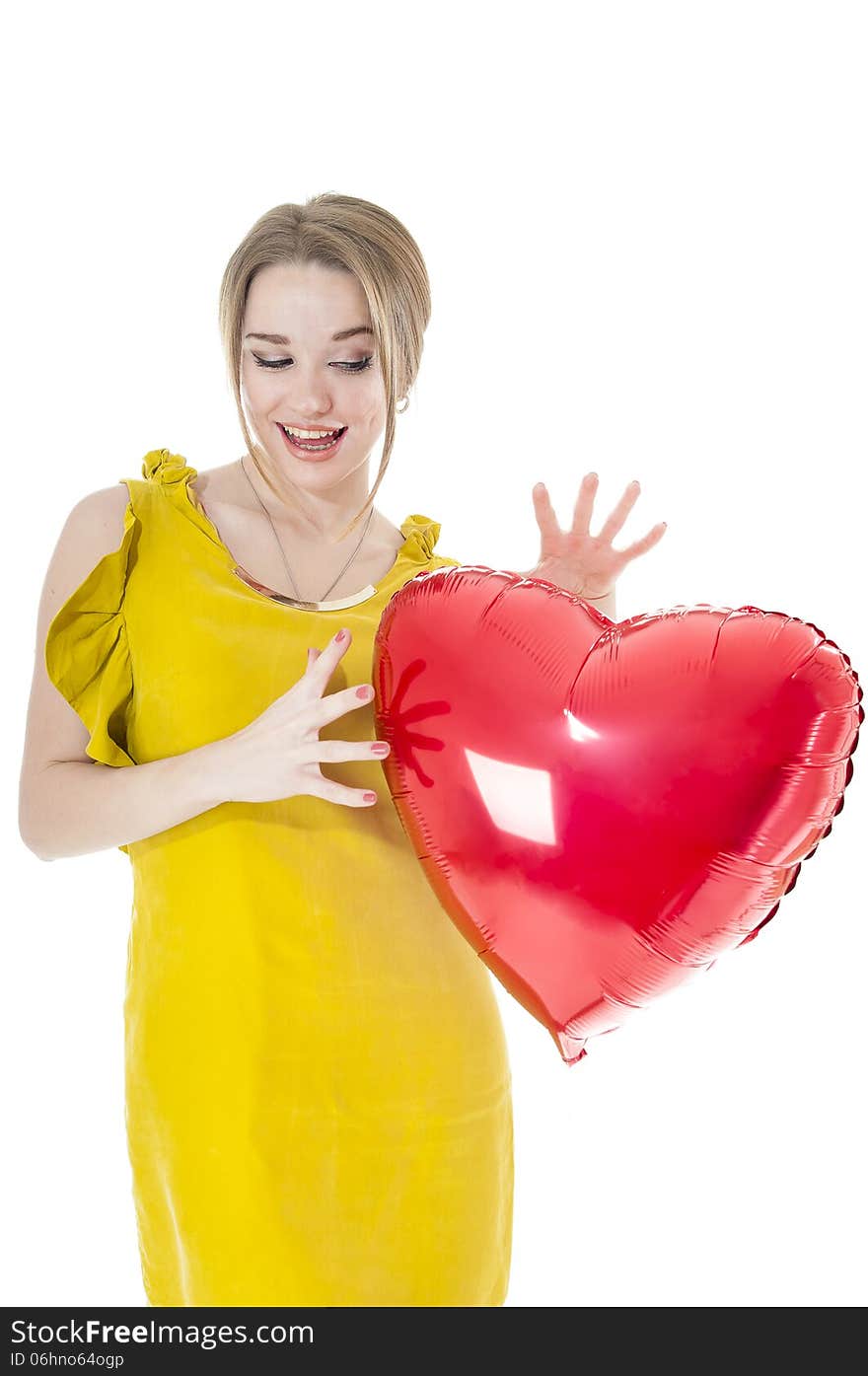 Funny woman holding red heart balloon over white background. Valentines day concepts.