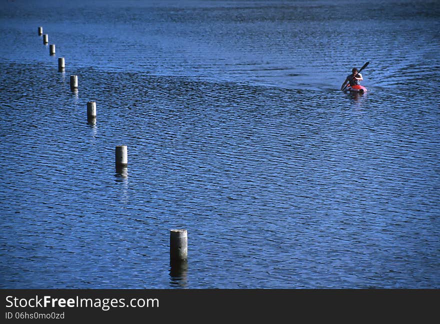 A lone kayaker on Wentworth Falls Lake. A lone kayaker on Wentworth Falls Lake