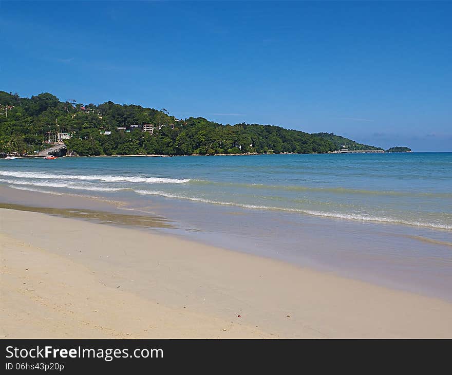 View from sea at coastline with mountains in distance. View from sea at coastline with mountains in distance