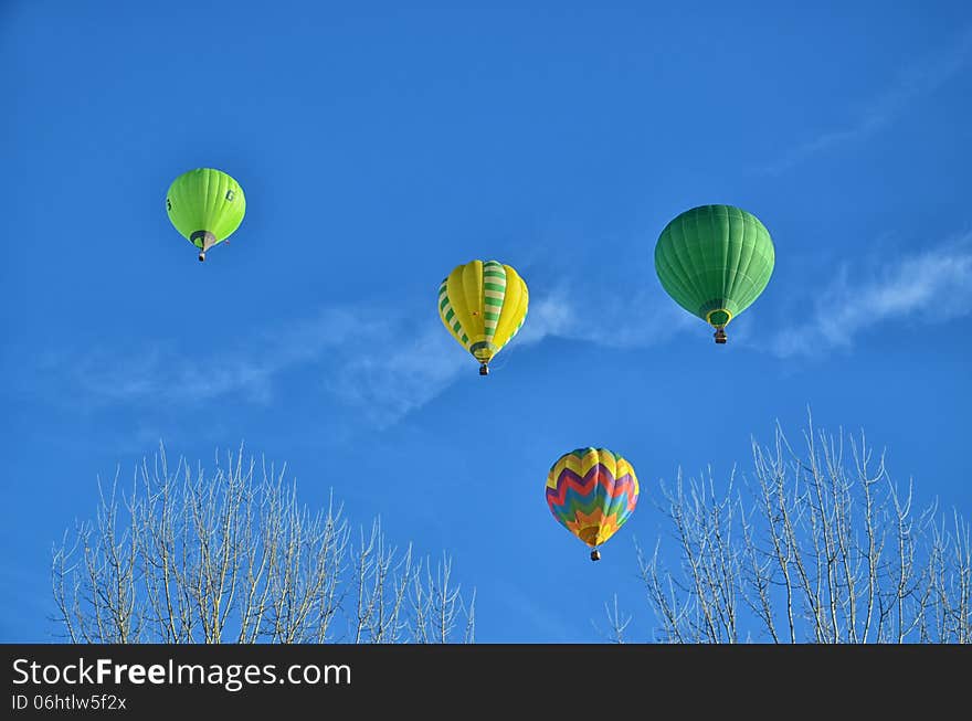 Multicolored and Striped Hot Air Balloons in the sky. Multicolored and Striped Hot Air Balloons in the sky