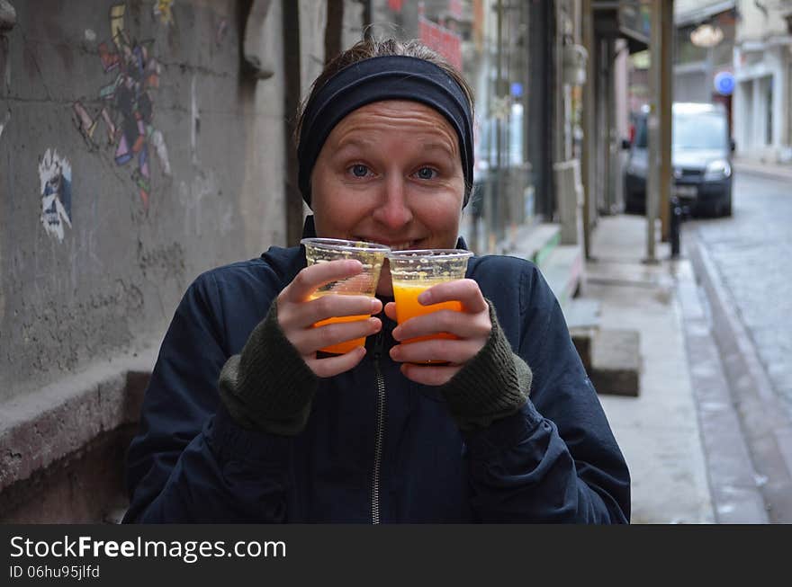 Girl With Two Cups Of Juice