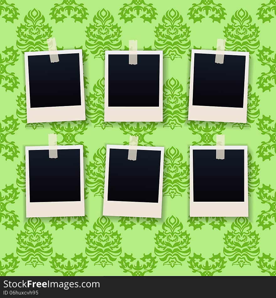 Photo frames on wallpaper background