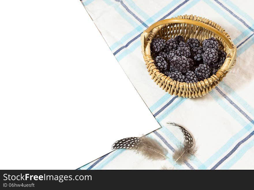 Frosted blackberry in wicker - blue rustic background. Frosted blackberry in wicker - blue rustic background