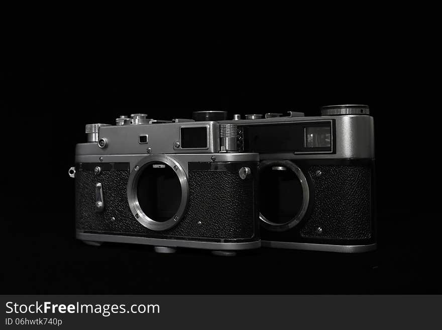 Analog retro photo camera on a dark background. Without lens. Analog retro photo camera on a dark background. Without lens