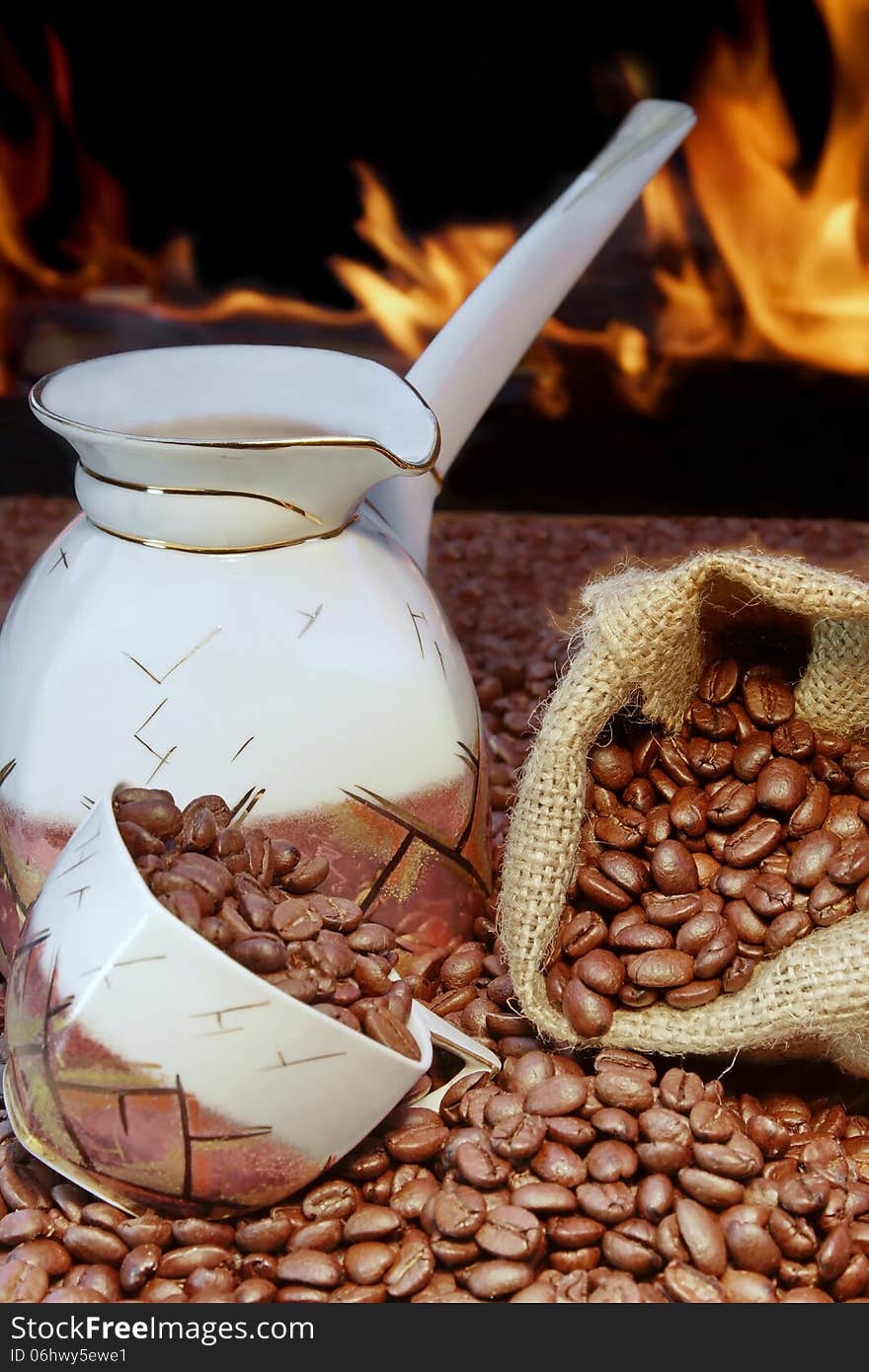 Coffee set and scattered beans, open fireplace in background XXXL