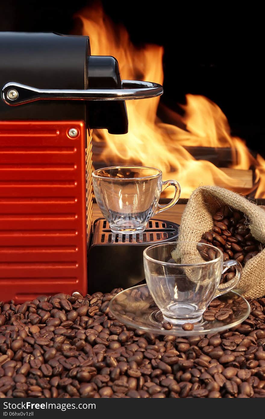 Capsule Coffee machine with two espresso cups near fireplace