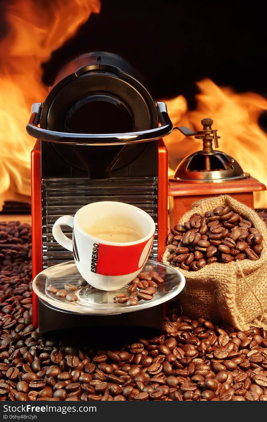 Capsule Coffee machine with  espresso cup near fireplace