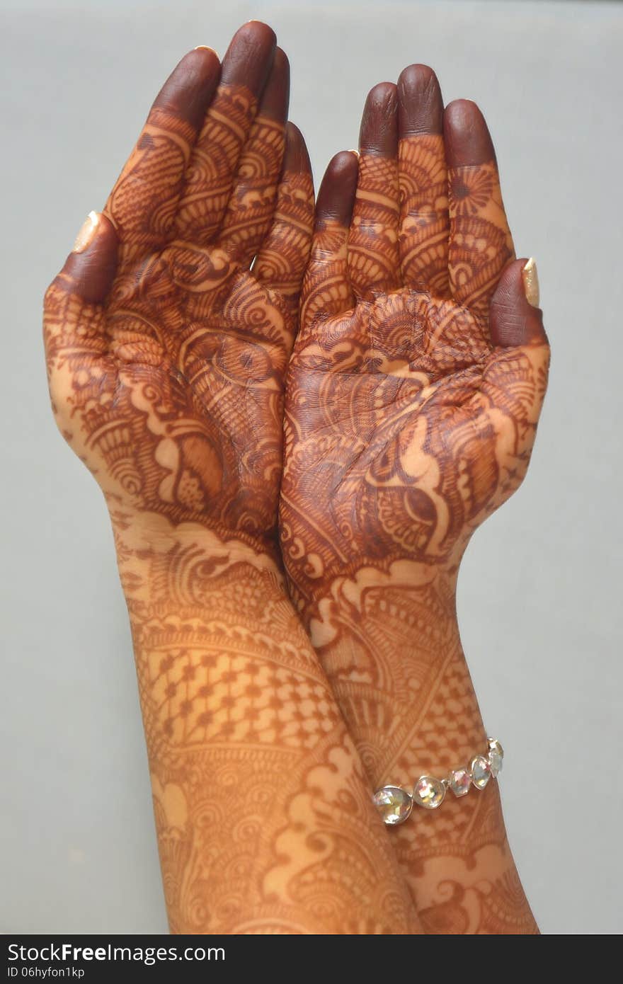 Indian bride showing her hands with henna. Indian bride showing her hands with henna