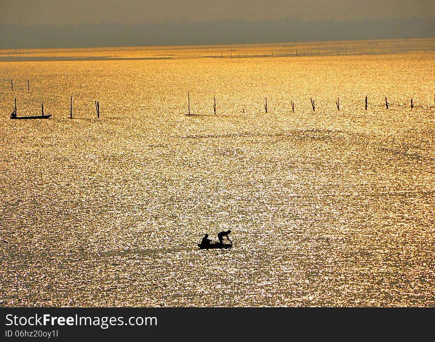 Silhouette of a man in a boat. Silhouette of a man in a boat