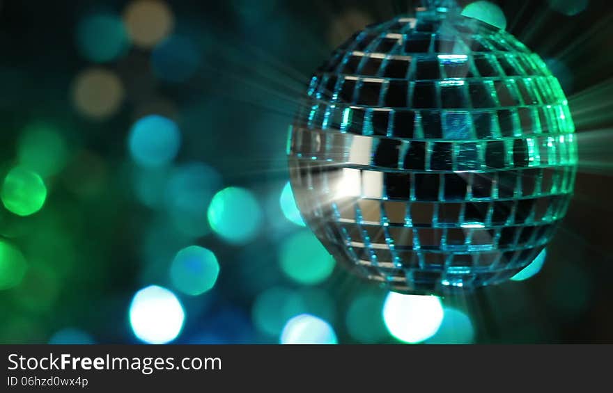 Colorful abstract background. Mirror ball in the foreground. Seamless loop. Colorful abstract background. Mirror ball in the foreground. Seamless loop