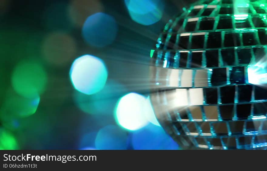 Colorful abstract background. Mirror ball in the foreground. Seamless loop. Colorful abstract background. Mirror ball in the foreground. Seamless loop