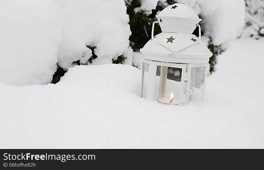 Candle lantern in the snow