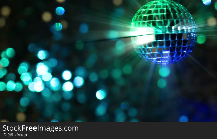 Colorful abstract background. Mirror ball in the foreground. Seamless loop. Colorful abstract background. Mirror ball in the foreground. Seamless loop