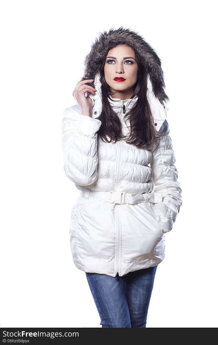 Pretty girl in winter clothes posing on white background. Pretty girl in winter clothes posing on white background