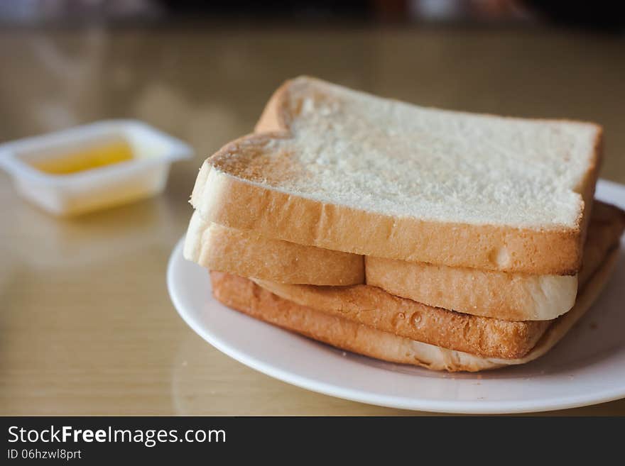 Breakfast with bread stacked on the dish.