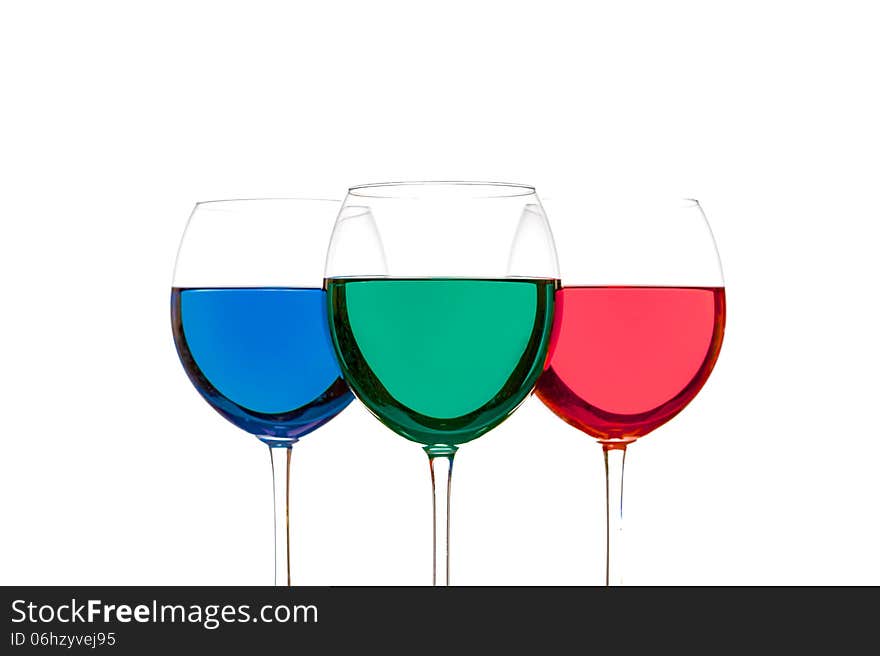 Colorful drinks in wine glasses