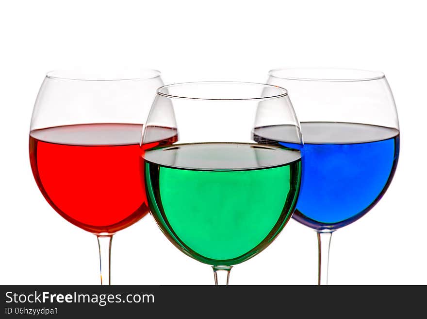 Colorful drinks in wine glasses