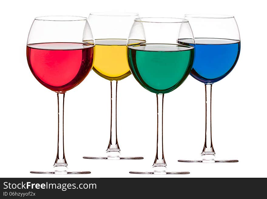 Colorful drinks in wine glasses