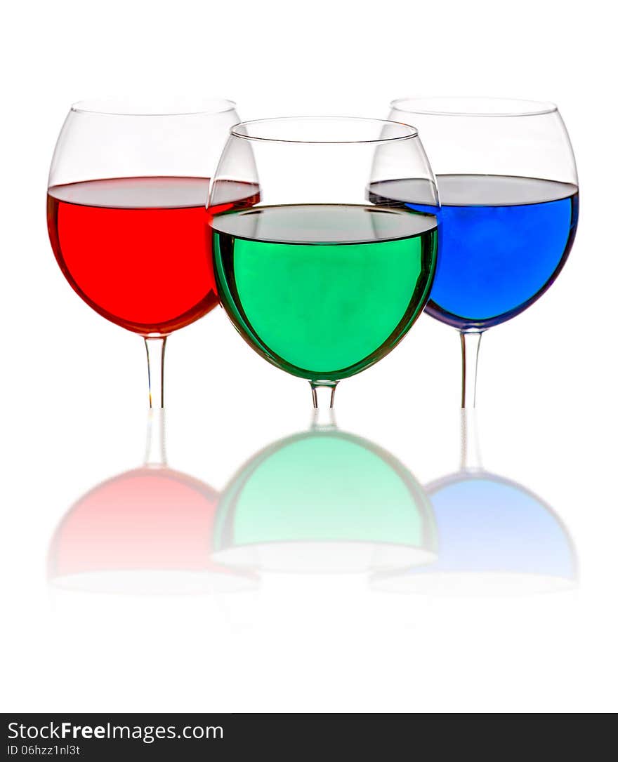 Colorful drinks in wine glasses